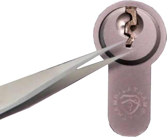 Removing a broken key with tweezers